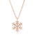 Light textures accent a simple snowflake design in this feminine necklace.